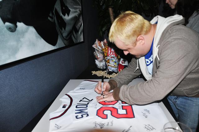 signing a jersey for a guest book signing a jersey for a guest book