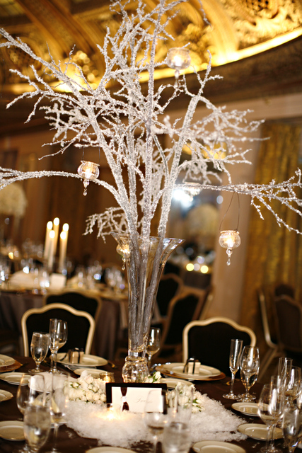 The winterinspired decor included crystal branch centerpieces and faux snow