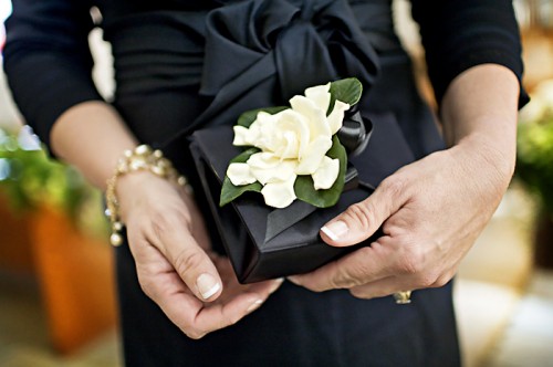 For the modern mom instead of a corsage attache a small flower to a clutch