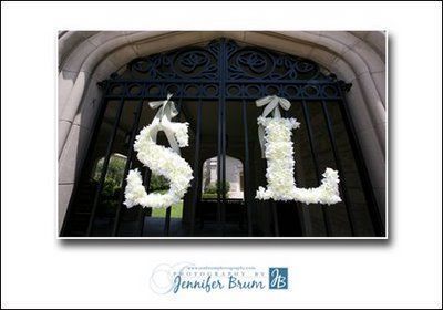 white-flower-monogram-letters-on-church-gates white-flower-monogram-letters-on-church-gates