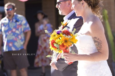bohemian-fiesta-wedding-bride-walking-down-aisle-multicolored-bouquet bohemian-fiesta-wedding-bride-walking-down-aisle-multicolored-bouquet