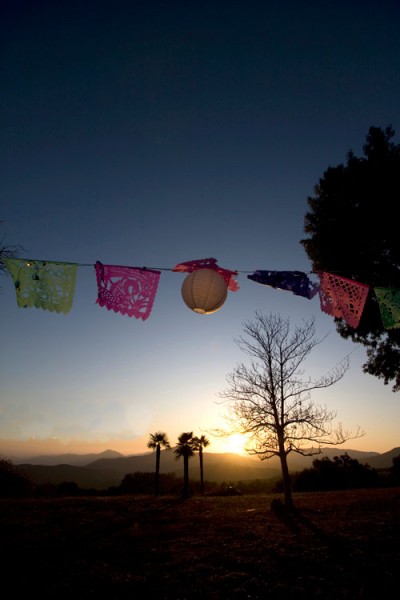 papel-picado-flags-hung-at-wedding-reception papel-picado-flags-hung-at-wedding-reception