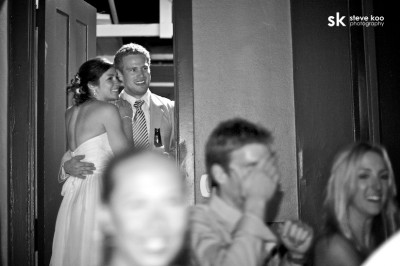 bride-and-groom-looking-out-at-guests