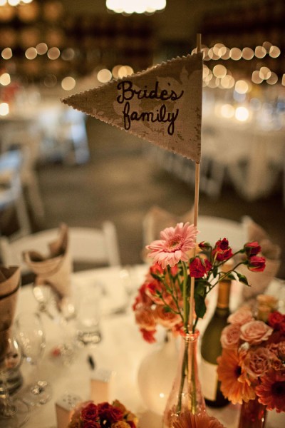 fabric-flag-table-numbers-centerpiece-flowers-in-shades-of-pink