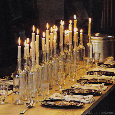  Clear wine bottles with gorgeous tapered candles at all different 