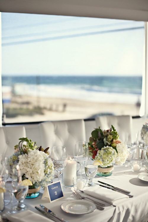 green black and white wedding ideas. white-green-centerpieces-beach