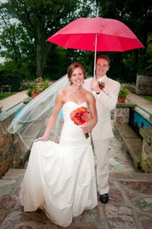 bride-and-groom-with-red-umbrella