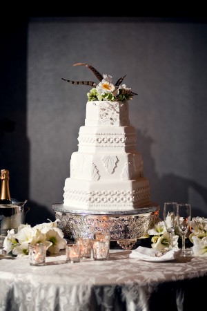 Elegant White Wedding Cake with Feather Cake Topper