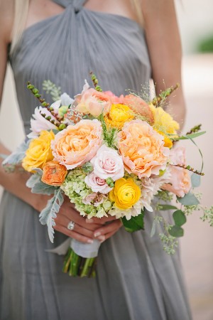 Gray Bridesmaids Dress with Orange Bouquet