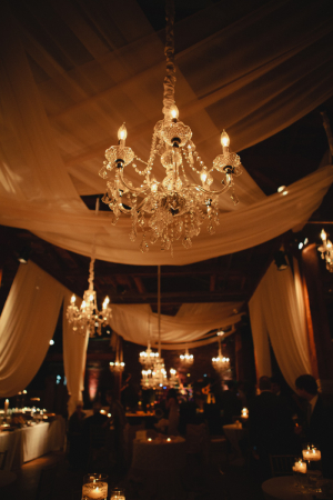Sheer Drapes and Chandelier Candlelight Reception Decor