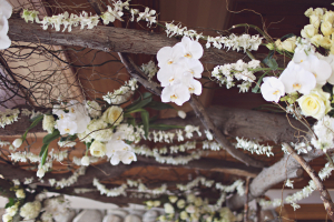 Wood Arbor With White Flowers