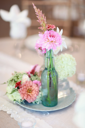Pink and White Flowers in Blue Bottle Vase