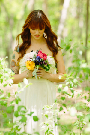 Bride Standing in Woods