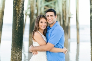 Engaged Couple Beneath Pier