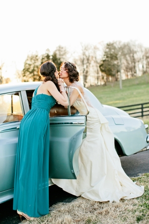 Bride and Bridesmaid at Vintage Getaway Car